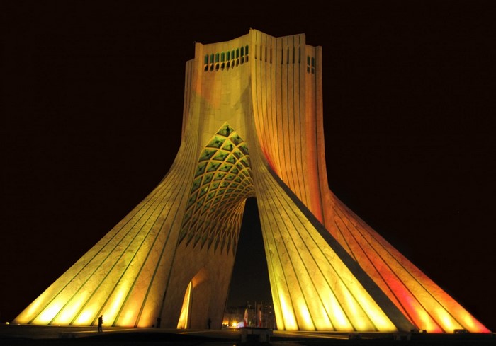 Azadi Tower illuminated at night in Tehran, Iran