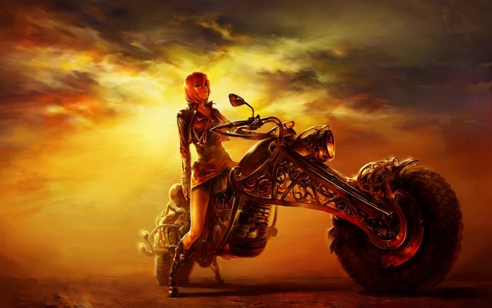 Woman with a custom motorcycle at sunset