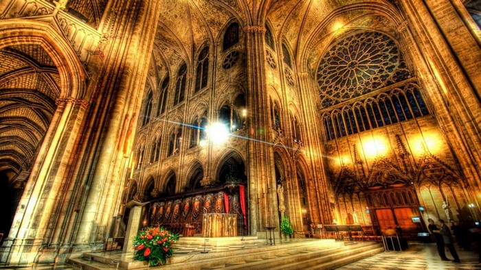 Interior of a grand cathedral with stained glass windows