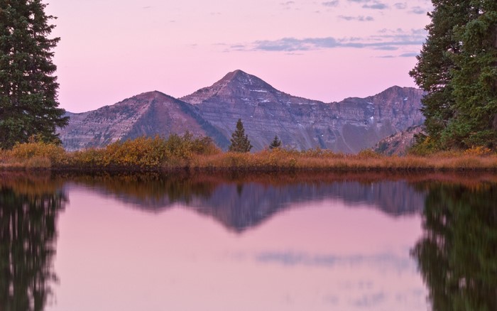 Mountain reflection in a lake at sunset