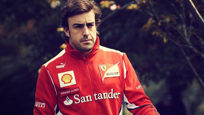 Fernando Alonso wearing a red Scuderia Ferrari jacket
