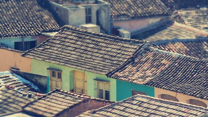 Tiled roofs of colorful houses in a dense urban area