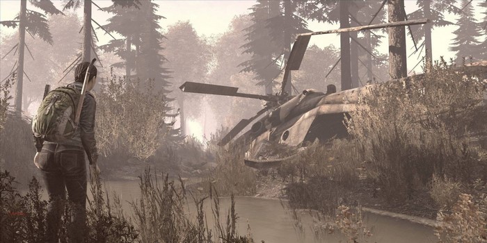 Survivor with backpack near crashed helicopter in forest