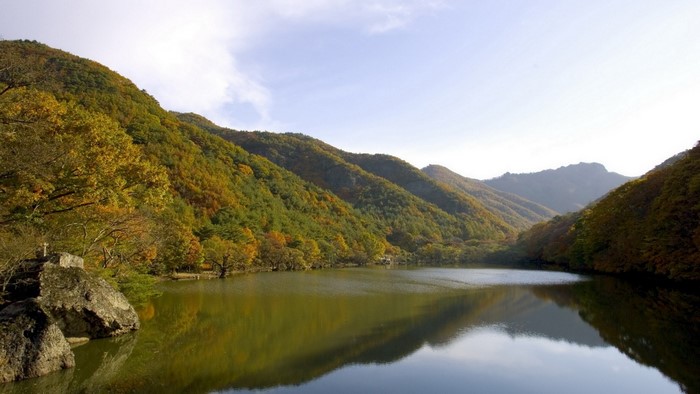 Autumn landscape with lake and mountains