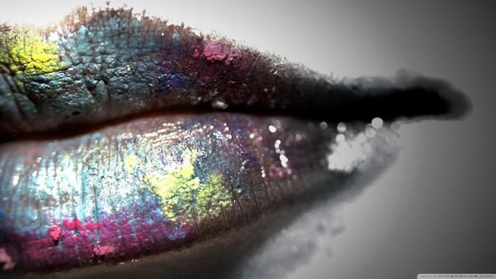 Close up of lips with colorful glitter makeup