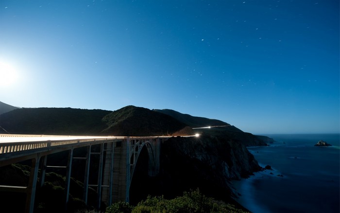 Bixby Bridge at night with ocean and mountains