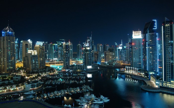 Dubai Marina skyscrapers and yachts at night