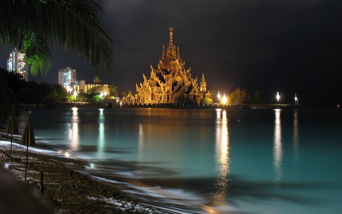 Sanctuary of Truth temple at night with reflections