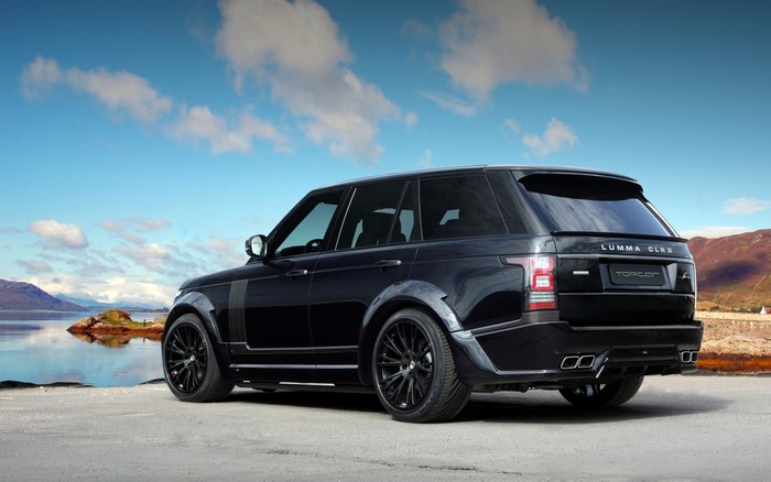 Black Lumma CLR Range Rover on a rocky shore