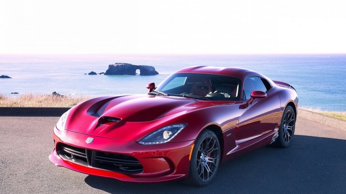 Red Dodge Viper parked by the ocean