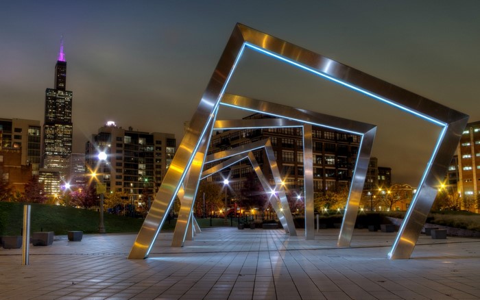 Chicago cityscape at night with modern sculpture