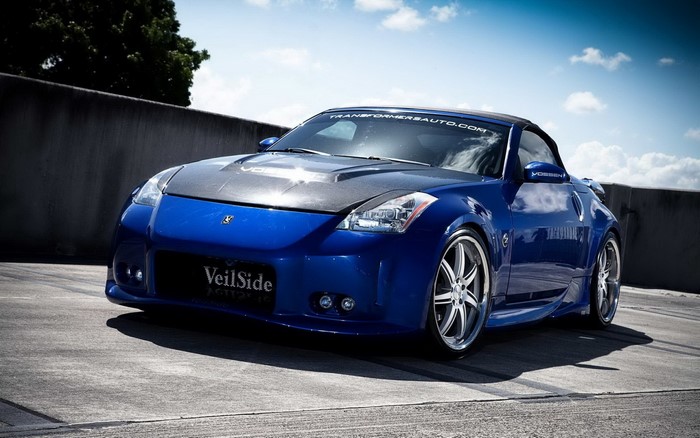 Blue Nissan 350Z Veilside sports car with carbon fiber hood