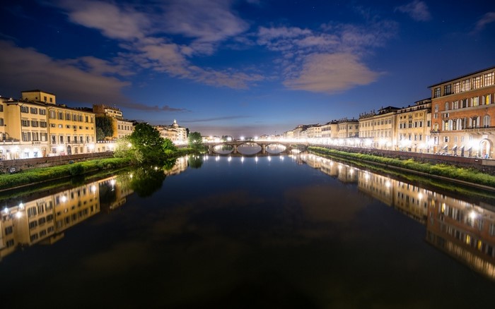 Florence cityscape at night with Arno River and Ponte Vecchio