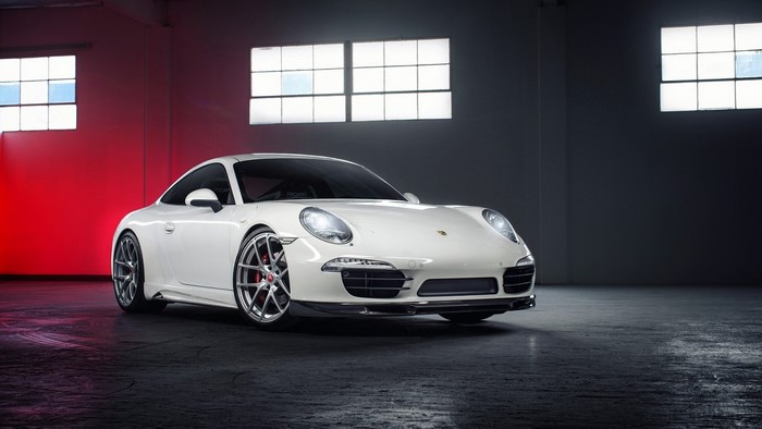 White Porsche 911 sports car in a studio