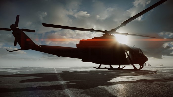 Silhouette of a military helicopter on a helipad