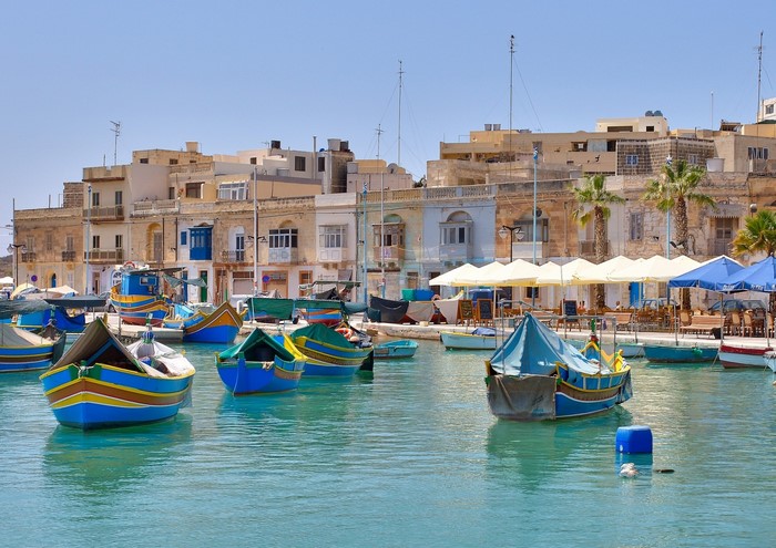 Colorful boats in a harbor in Malta