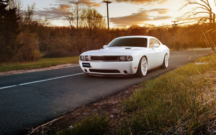 White Dodge Challenger on a Road at Sunset