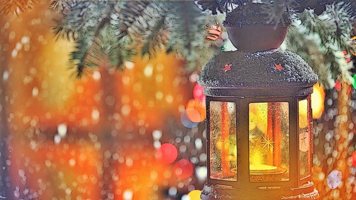 Christmas lantern with snow and bokeh lights