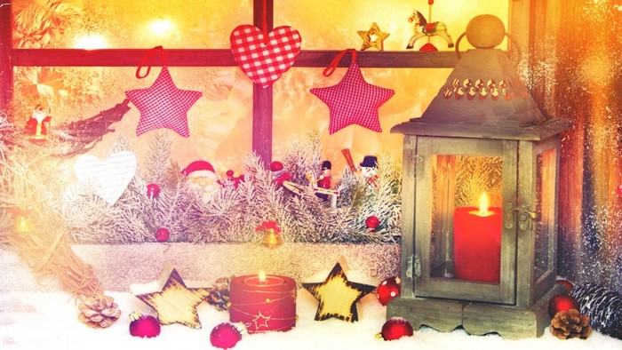 Christmas window decoration with lantern and candles