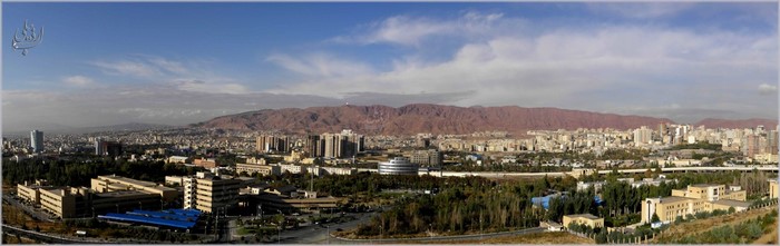 Panoramic cityscape of Tehran, Iran with mountains in background