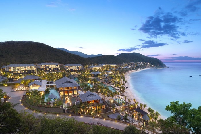 Resort on a tropical bay with mountains in the background