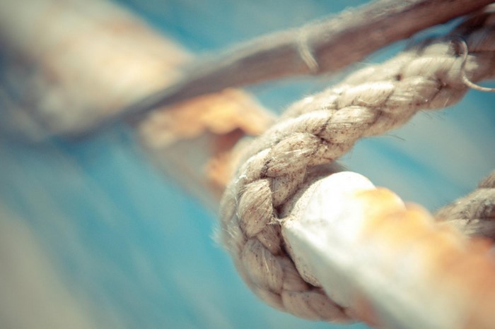 Close-up of a thick rope tied around a pole