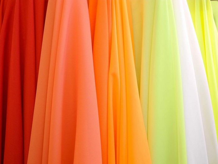 Colorful draped fabrics in a gradient of warm and cool colors