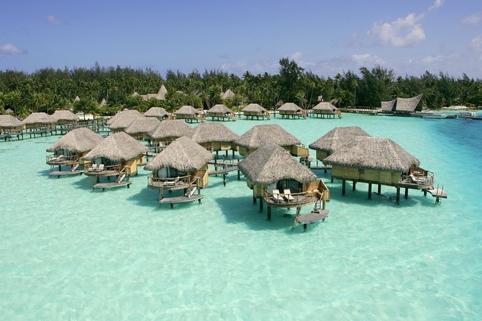 Overwater bungalows in a tropical lagoon resort