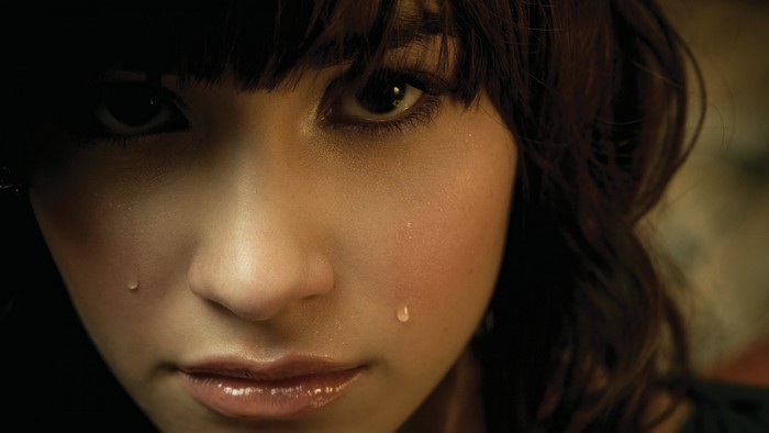 Close-up portrait of a crying young woman