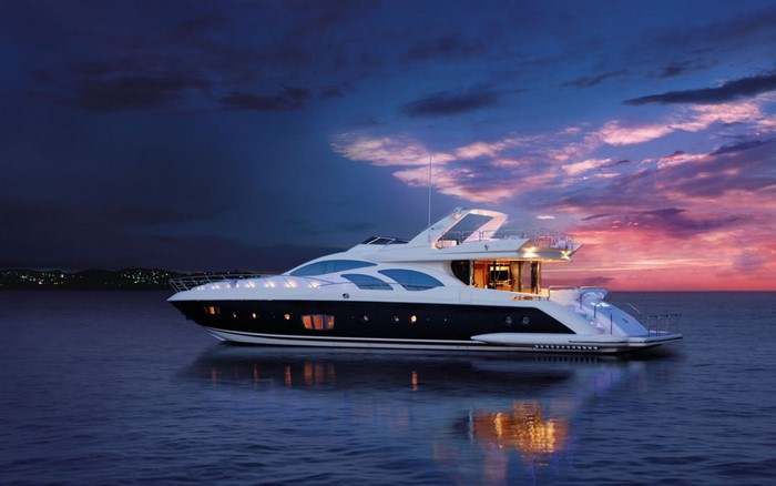 Luxury Yacht Sailing at Sunset on Calm Sea