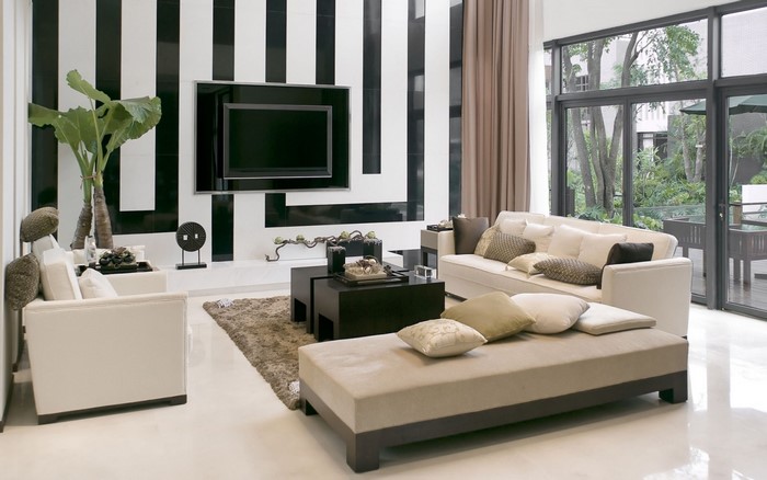 Modern living room with black and white striped wall and furniture