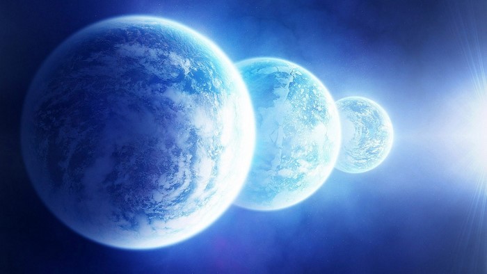 Three planets in deep space with bright light source