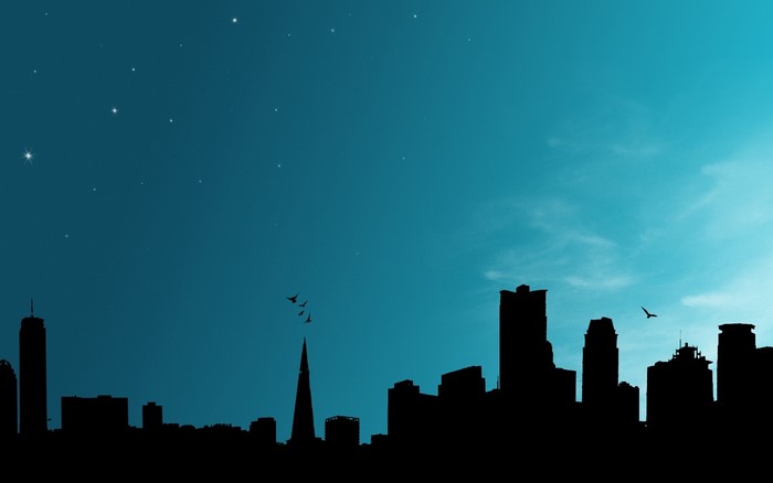 Silhouette of a city skyline at night with stars
