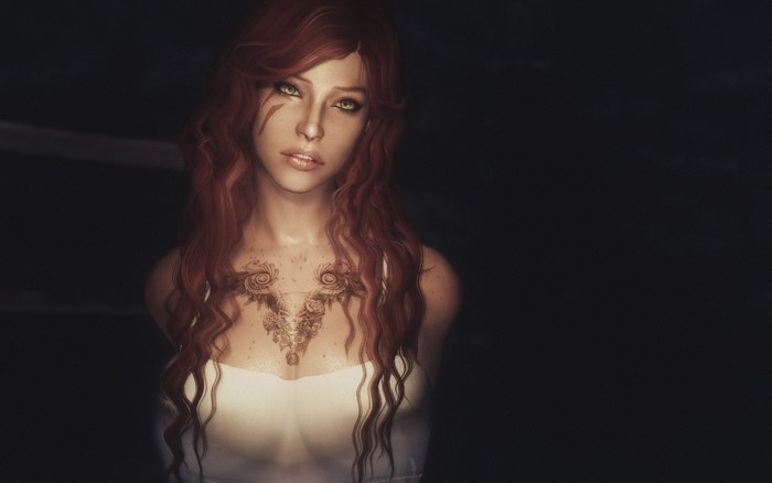 Woman with red hair and tattoos from The Elder Scrolls V Skyrim