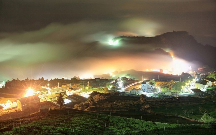 Night view of a village in Taiwan with fog and lights