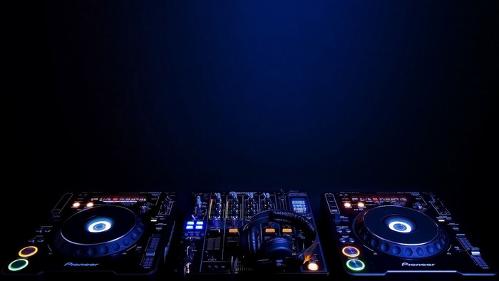 Pioneer DJ equipment with headphones on a dark background