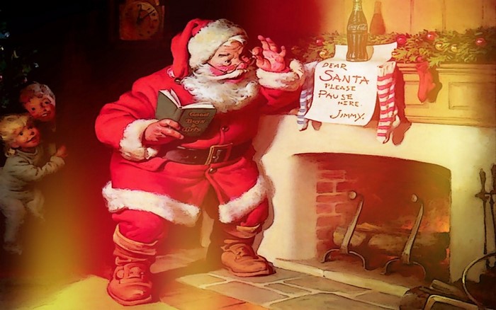 Santa Claus reading a book by the fireplace