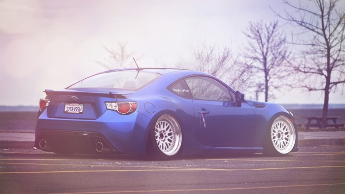 Blue Subaru BRZ sports car with custom wheels