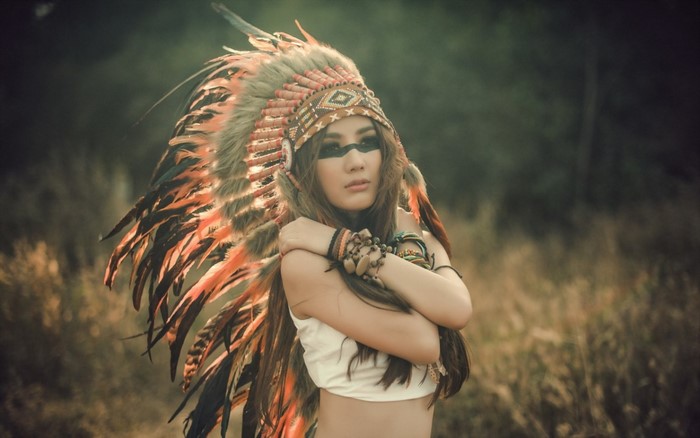 Woman with Native American Headdress and Face Paint
