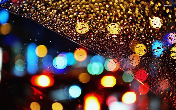 Bokeh lights on a rainy window