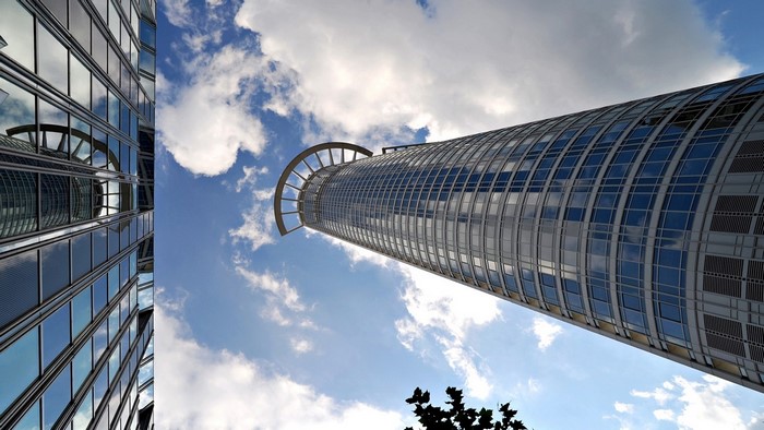 Modern skyscrapers against a cloudy blue sky
