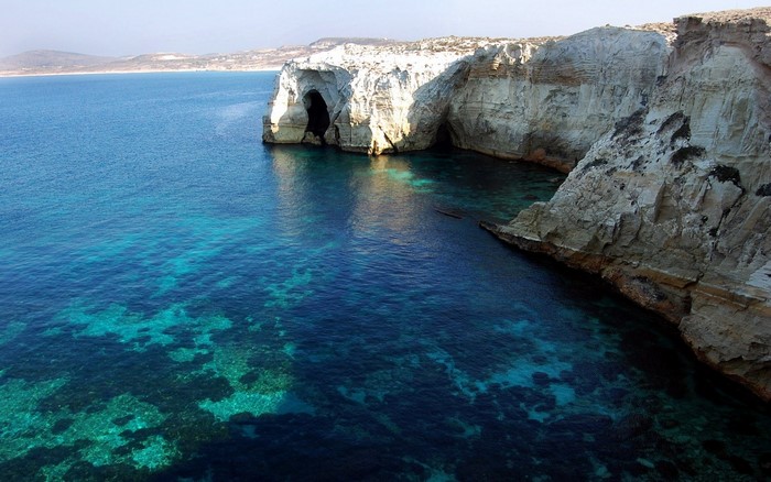 Sea caves along a rocky coast in Greece