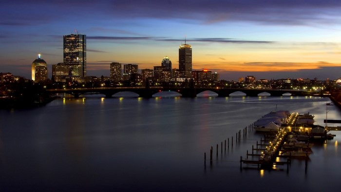 Boston cityscape at dusk with Charles River and bridge