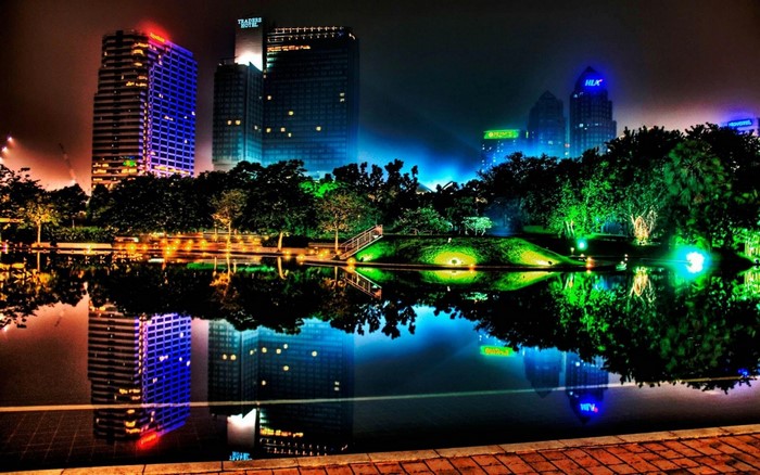 Colorful cityscape at night with reflections in water