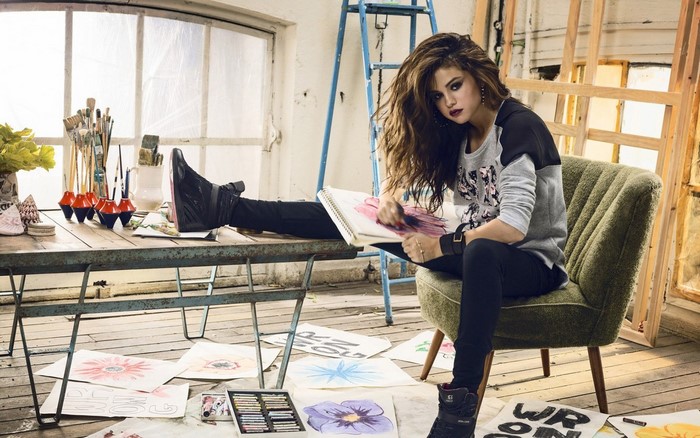 Selena Gomez in an art studio with drawings