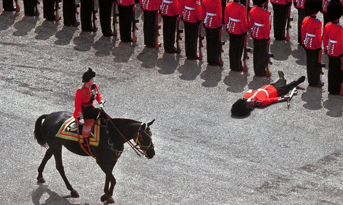 Soldier collapses during a ceremonial parade in England