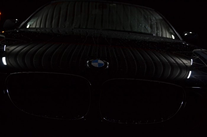 Black BMW car with water droplets