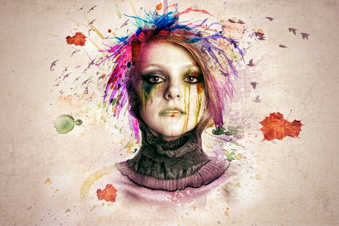 Woman with colorful paint splatters and birds