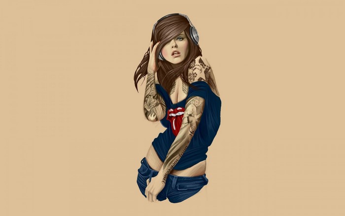 Woman with tattoos and headphones listening to music
