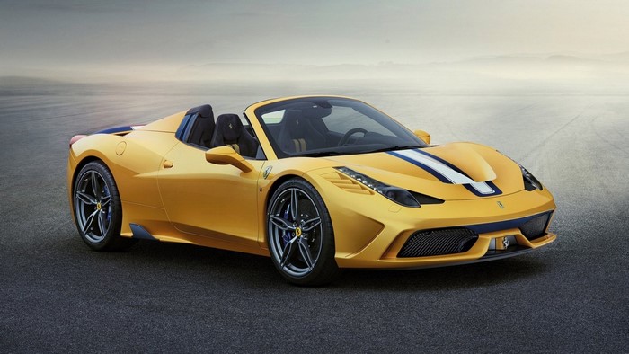 Yellow 2015 Ferrari 458 Speciale A convertible sports car